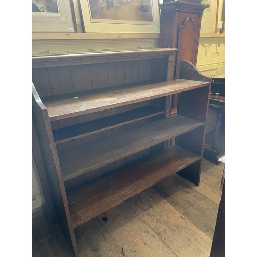 1410 - An oak bookcase, 124 cm wide, another, 127 cm wide, pine table, and two bedroom mirrors,