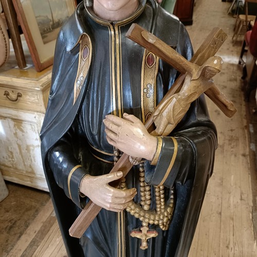 1469 - A carved wood and painted figure of a saint holding a crucifix, 145 cm high