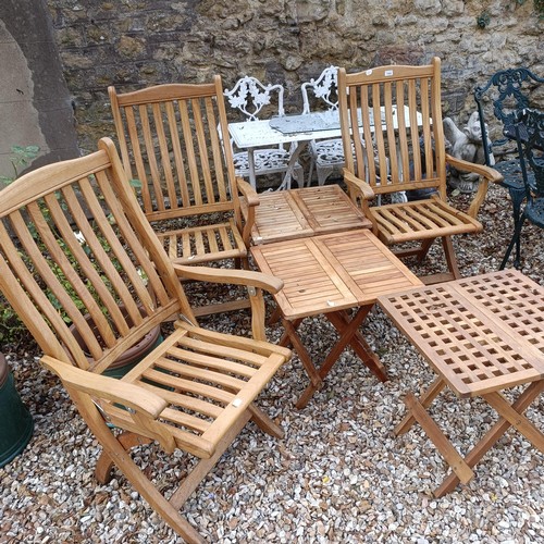 1494 - A set of three teak folding garden chairs, and three folding garden tables