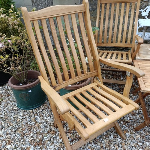 1494 - A set of three teak folding garden chairs, and three folding garden tables