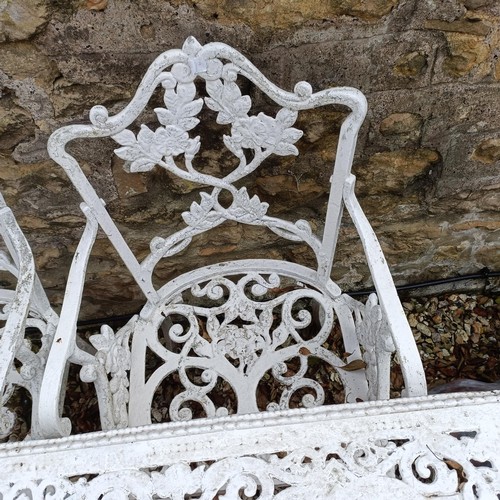 1491 - A painted metal garden table, 110 cm wide, and a pair of armchairs (3)