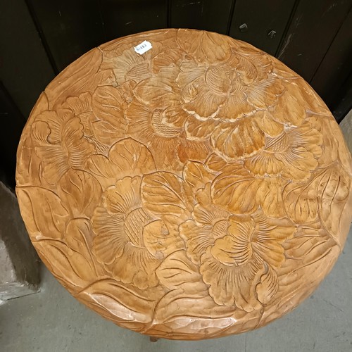 462 - A Liberty style carved two tier table, decorated leaves, 50 cm diameter