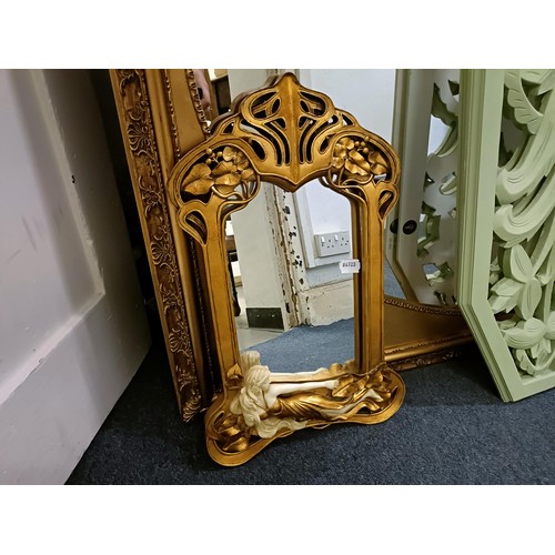 1537 - A gilt framed wall mirror, 110 x 137 cm, two other mirrors, and two painted panels with pierced deco... 