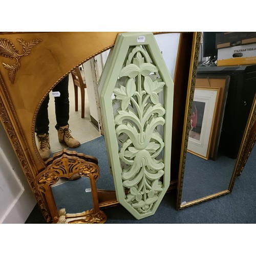 1537 - A gilt framed wall mirror, 110 x 137 cm, two other mirrors, and two painted panels with pierced deco... 