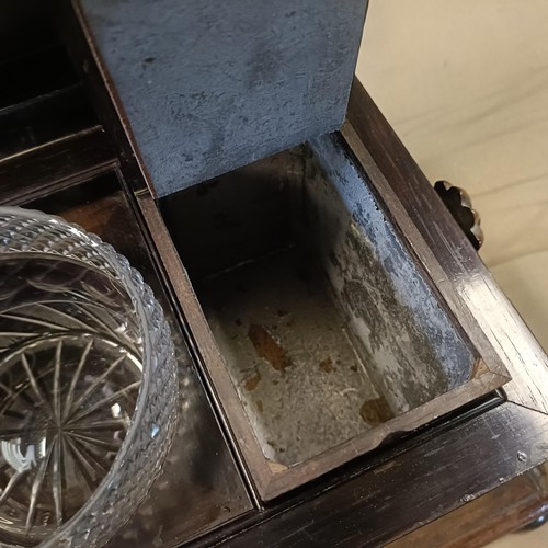 1341 - A 19th century rosewood tea caddy, a hinged lid to reveal a cut glass mixing bowl, repaired, and two... 