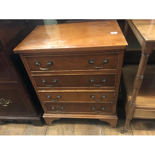 1414 - An inlaid mahogany kneehole dressing table, lacking back, 125 cm and a bedside chest (2)