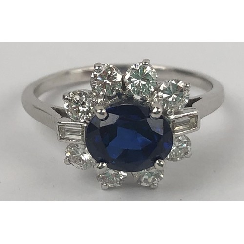 636 - A white metal, sapphire and diamond cluster ring, ring size M