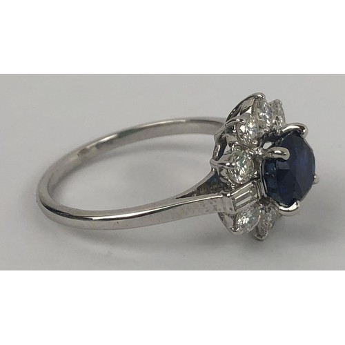 636 - A white metal, sapphire and diamond cluster ring, ring size M