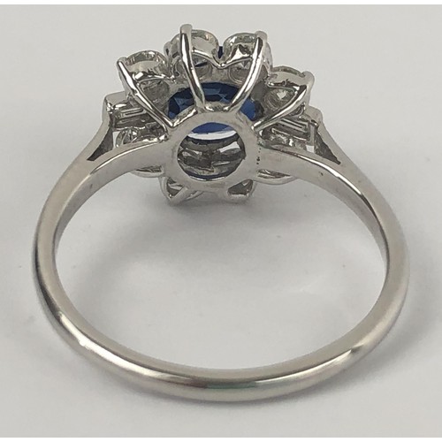 636 - A white metal, sapphire and diamond cluster ring, ring size M