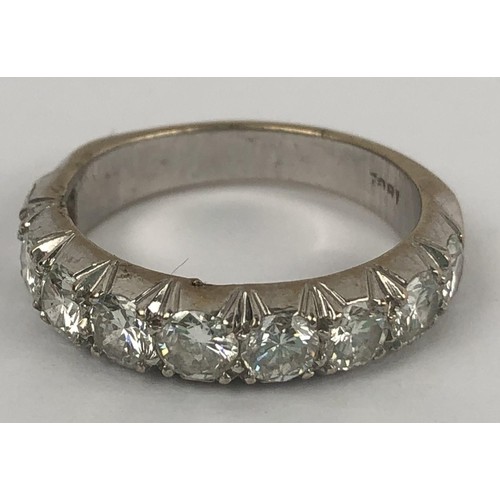 602 - An 18ct white gold and diamond half eternity ring, ring size M