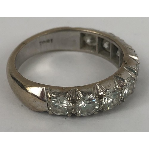 602 - An 18ct white gold and diamond half eternity ring, ring size M