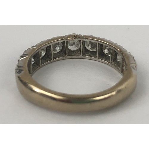 602 - An 18ct white gold and diamond half eternity ring, ring size M