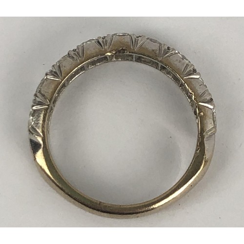 602 - An 18ct white gold and diamond half eternity ring, ring size M