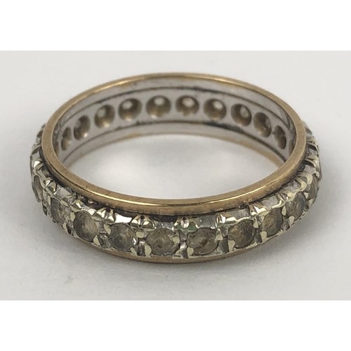 606 - A white stone eternity ring, ring size M