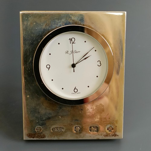 41 - A small silver mounted clock, London 2000, 5.5 cm wide, and another similar (2)