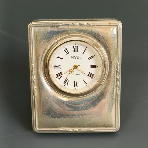 41 - A small silver mounted clock, London 2000, 5.5 cm wide, and another similar (2)