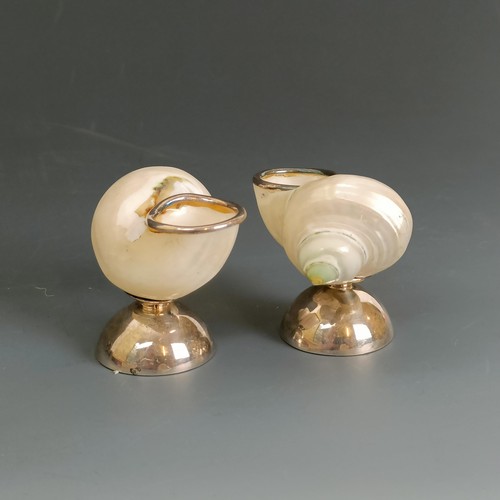 66 - A pair of sterling silver and shell salts, a pair of silver coloured metal salts, .800, and a pair o... 