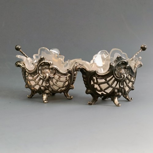 66 - A pair of sterling silver and shell salts, a pair of silver coloured metal salts, .800, and a pair o... 