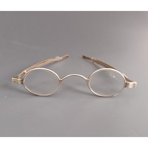 67 - A pair of silver spectacles, and two other pairs (3)