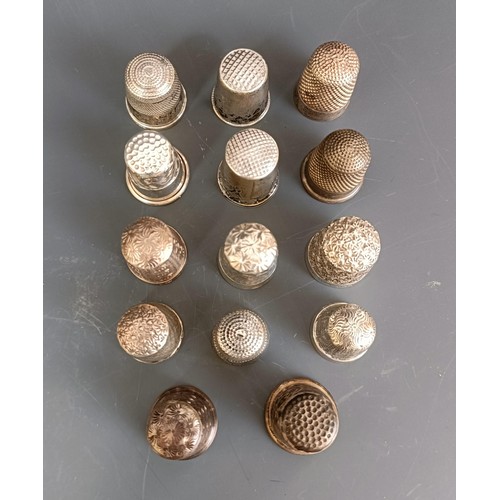 174 - A group of fourteen assorted silver thimbles