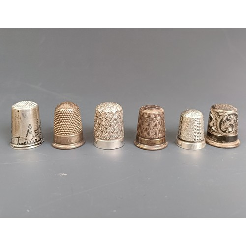 174 - A group of fourteen assorted silver thimbles