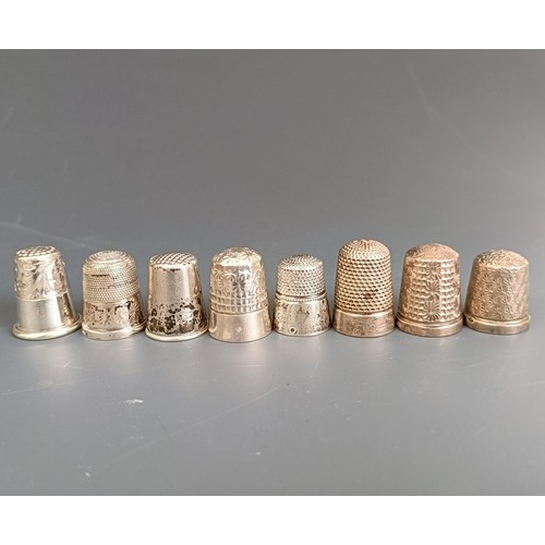 174 - A group of fourteen assorted silver thimbles