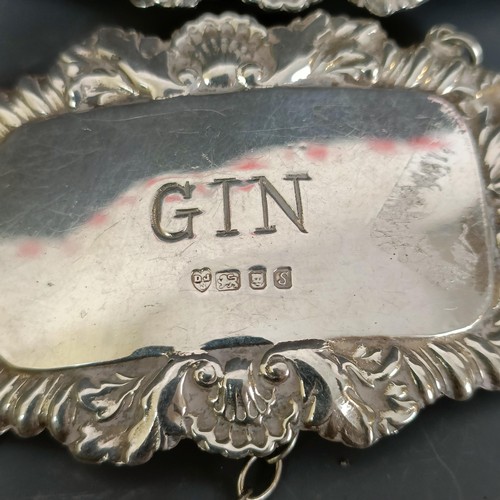 184 - A group of nine silver decanter labels