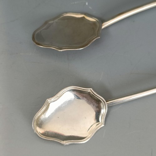 193 - A pair of Continental silver coloured metal cocktail stirrers, 18.5 cm (2)