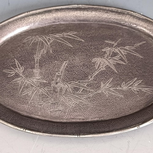 195 - A Hong Kong sterling silver dish, of oval form, decorated bamboo, 15.5 cm wide