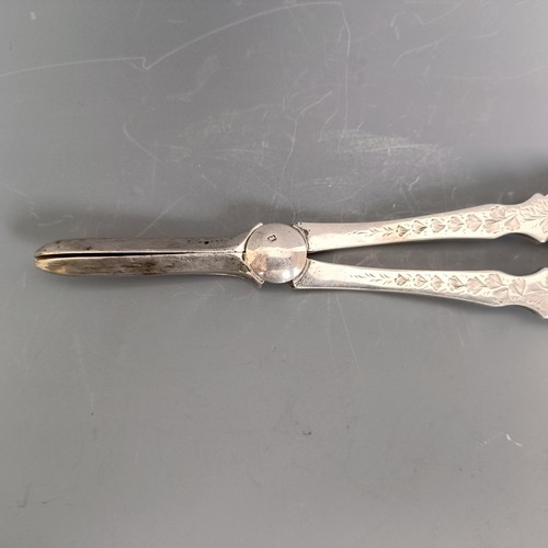 202 - A pair of Victorian style silver grape scissors, with engraved decoration, Sheffield 1931, 3.9 ozt