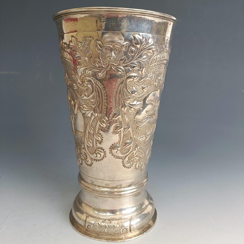 211 - A Russian silver beaker of tapering cylindrical form, embossed figures, flowers and foliage, marks i... 