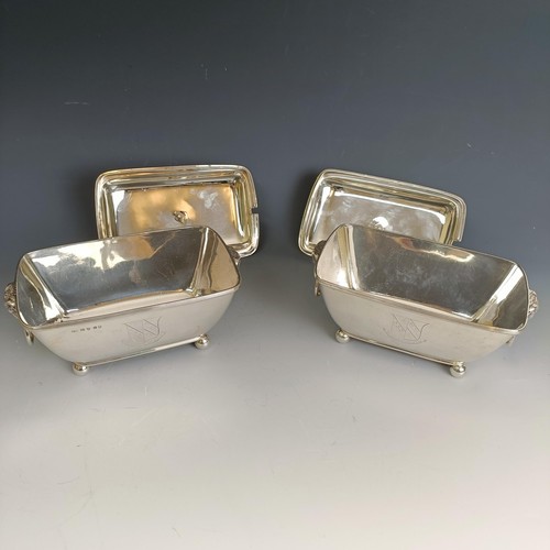 212 - A pair of George III silver dishes and covers, with pineapple style finials and rams mask ring handl... 