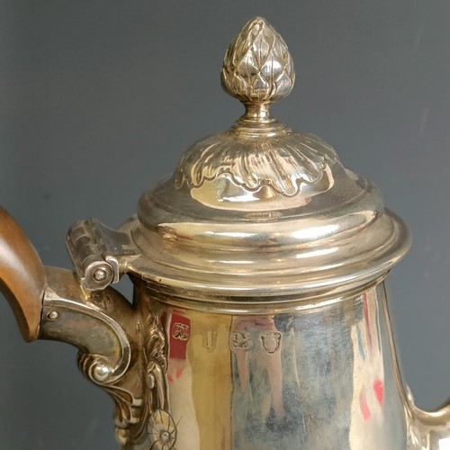 213 - A mid 18th century silver coffee pot, of baluster form, embossed flowers, marks rubbed, probably Lon... 