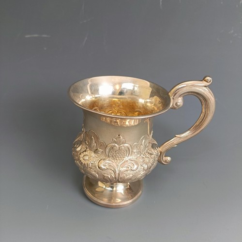 231 - A William IV silver christening mug, of vase form, embossed flowers and foliage, London 1837, 4.1 oz... 