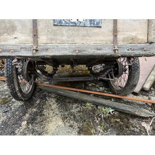 8 - An old trailer, probably based on an Austin 7, with springs and wire wheels, barn stored