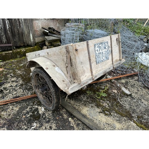 8 - An old trailer, probably based on an Austin 7, with springs and wire wheels, barn stored