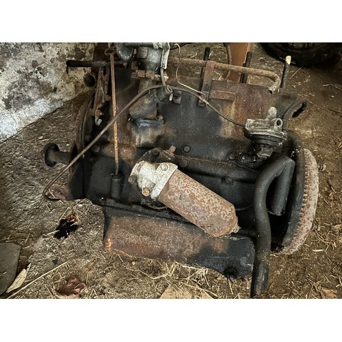 9 - An engine, possibly Triumph TR4, with a box of items, two fuel tanks and a back axle, conditions unk... 