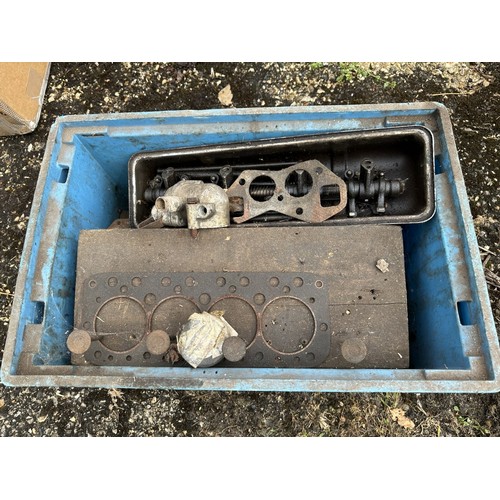 9 - An engine, possibly Triumph TR4, with a box of items, two fuel tanks and a back axle, conditions unk... 