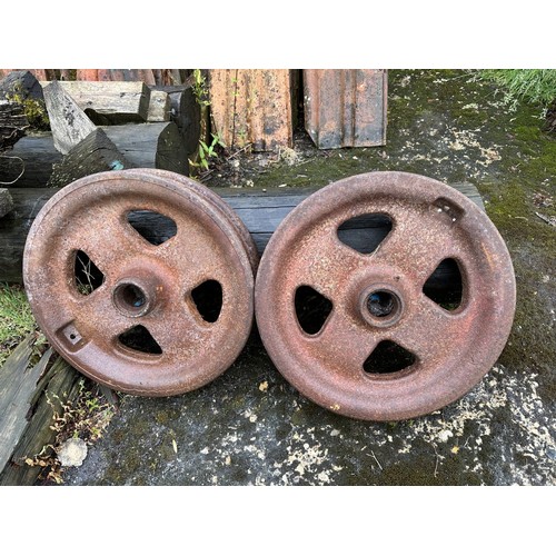 12 - A pair of iron pulley type wheels, 54 cm diameter