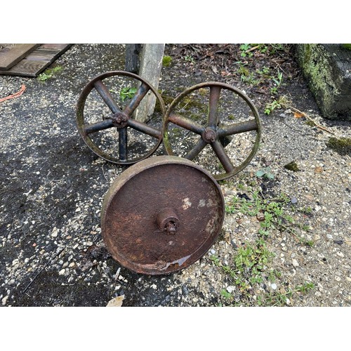 25 - A pair of cast iron wheels, and another, probably from a chicken coop (3)