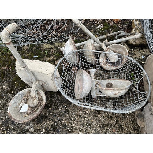 29 - Five galvanised metal cow licks, a galvanised metal basket and six homemade and galvanised metal fee... 