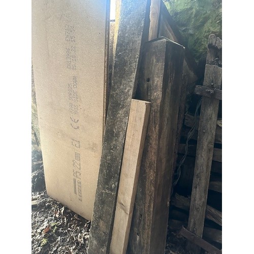 49 - Assorted gate posts, wooden sheets and other timber