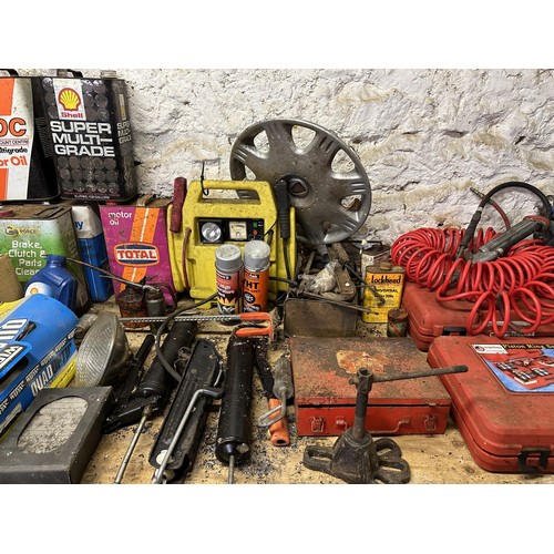 77 - Assorted headlamps oil cans and tools (on top of the work bench)