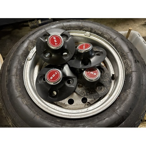 82 - A set of four Triumph TR6 steel wheels, with tyres and hub caps