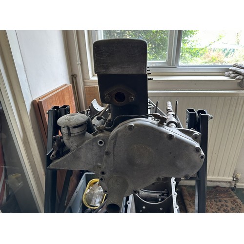 85 - An Alvis engine on a metal stand, and in pieces, understood to be from a 1927 Alvis TG 12/50 Sports ... 