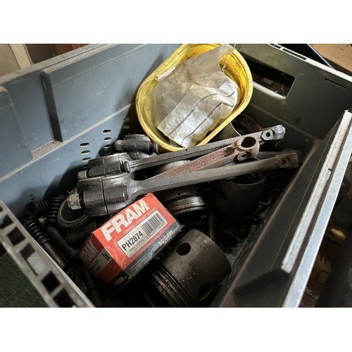 An Alvis engine on a metal stand, and in pieces, understood to be from ...