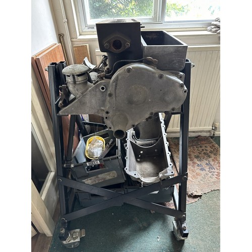 85 - An Alvis engine on a metal stand, and in pieces, understood to be from a 1927 Alvis TG 12/50 Sports ... 