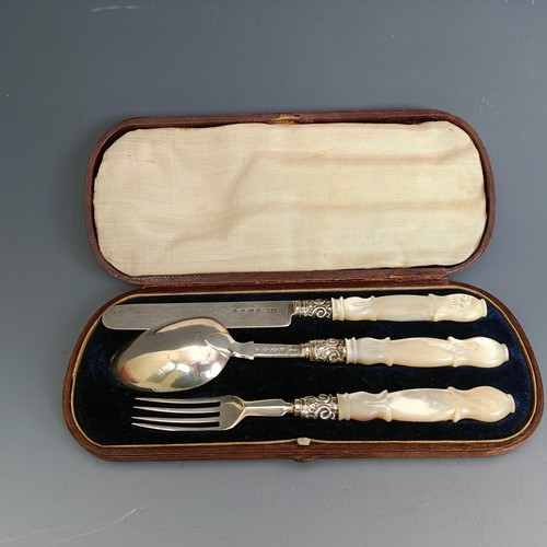 238 - A silver and mother of pearl three piece christening cutlery set, Birmingham 1860, cased