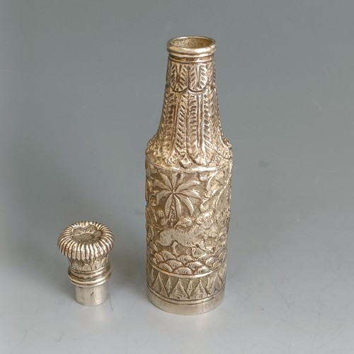 246 - An Indian silver coloured metal bottle, decorated animals and foliage, 11.5 cm