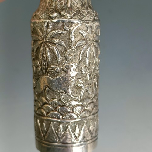 246 - An Indian silver coloured metal bottle, decorated animals and foliage, 11.5 cm